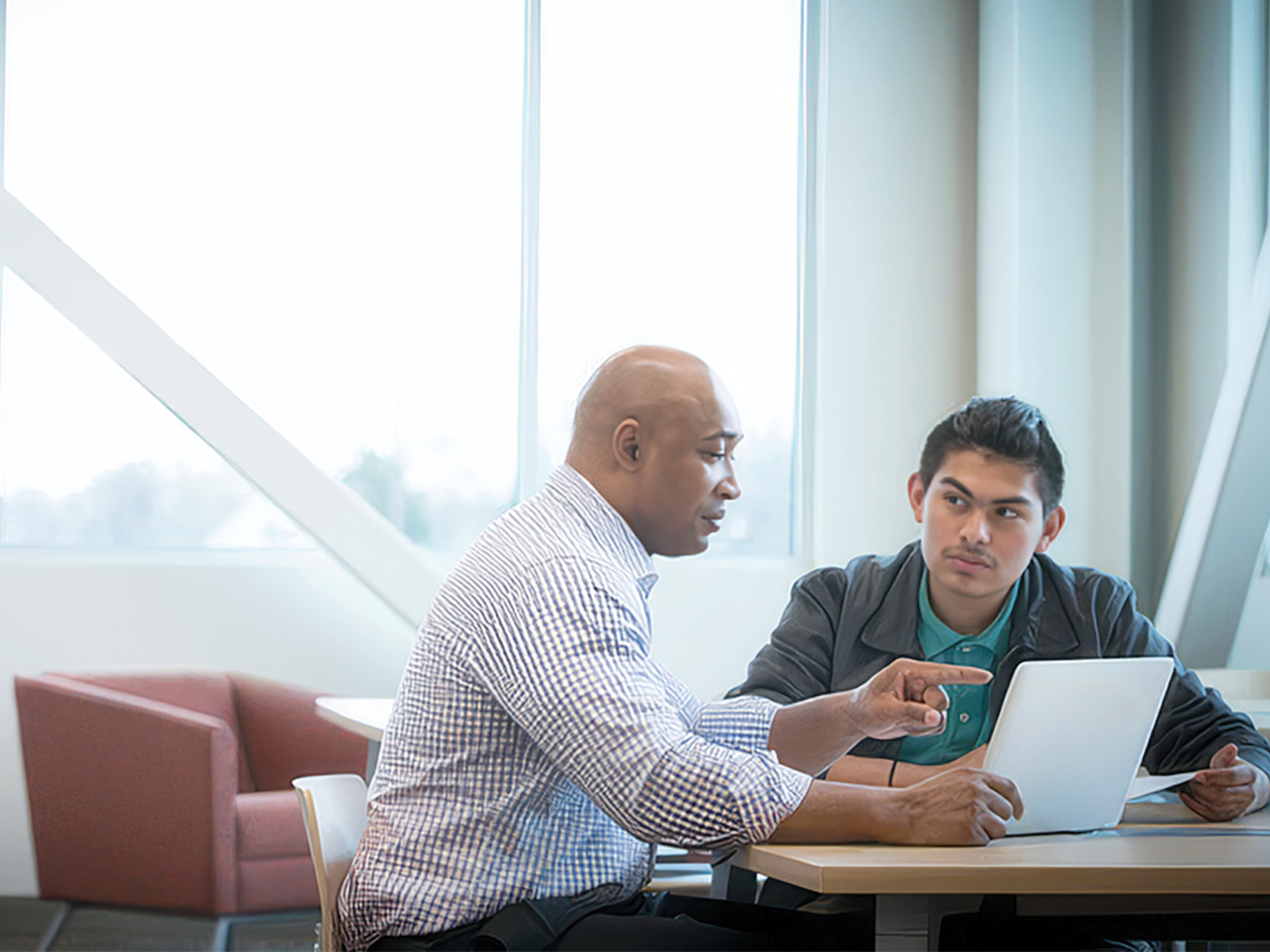 Two colleagues in conversation — candid moment of collaboration